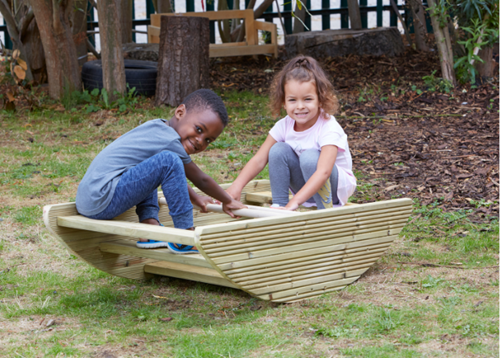 Cosy outdoor rocking boat and steps