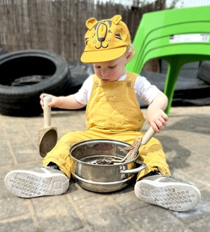 Child stirring pot