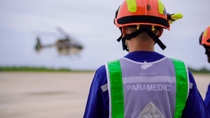 Paramedic watching the emergency helicopter