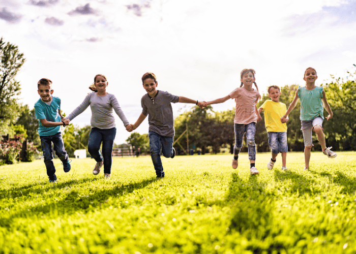 children holding hands and playing