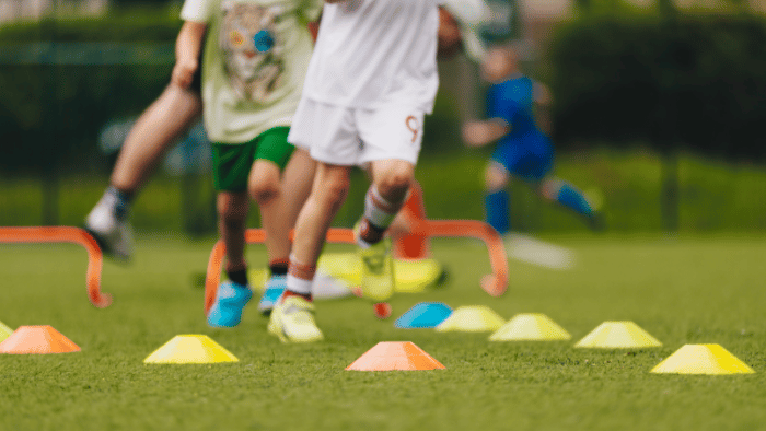 children running around cones