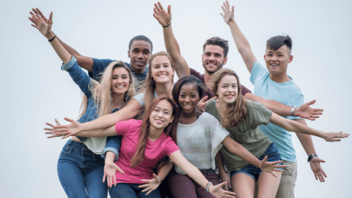 A group of people with their hands up
