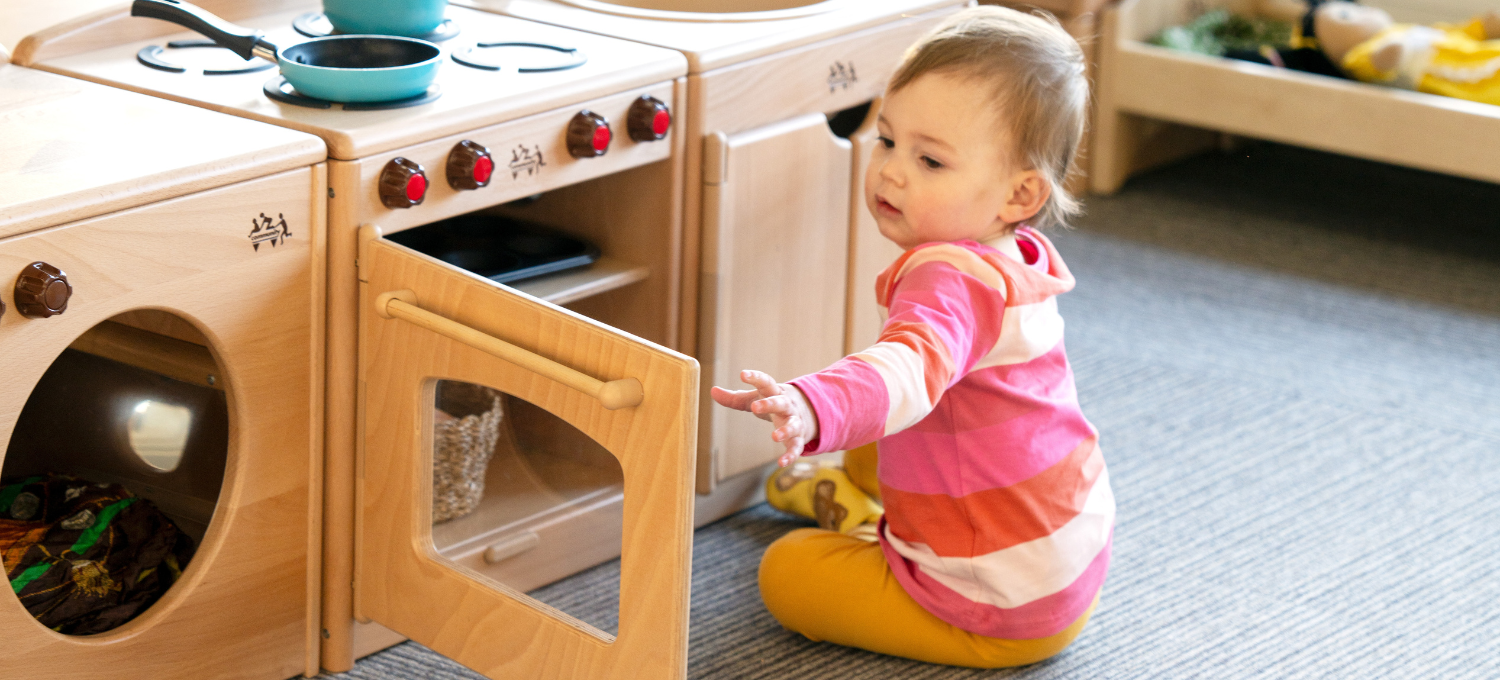 Toddler playing with furniture