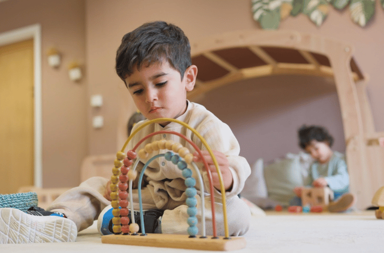 Child sat in early years classroom