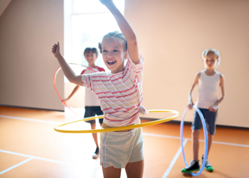 Children playing sports in school