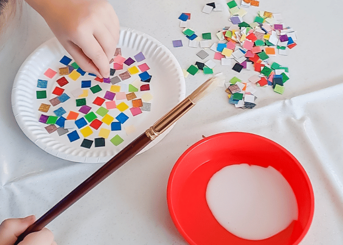 Paper Plate being decorated with mosaic