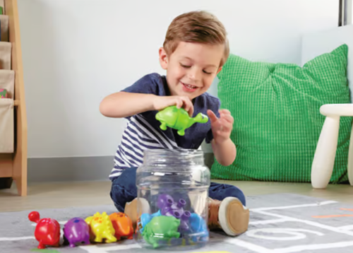 Child playing with dinosaurs