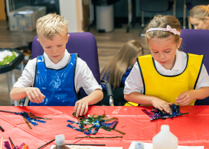 Young girl and boy making handheld sparklers