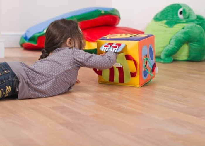 child playing with a soft play getting ready cube 
