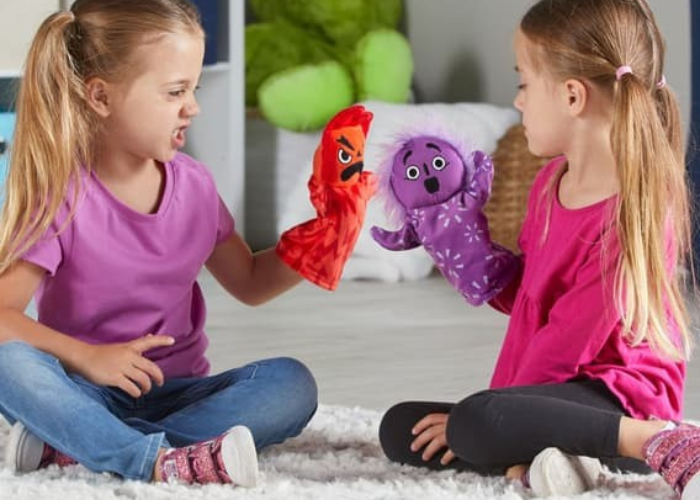 children playing with puppets