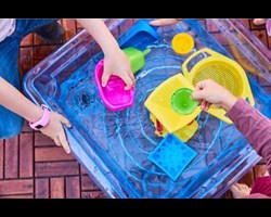 child playing with activity tray