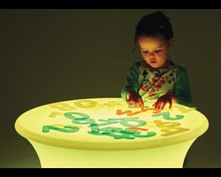 child playing with sensory mood table