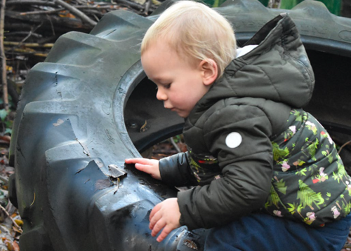 Young boy playing outside