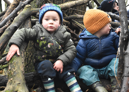 Children playing in outdoor den