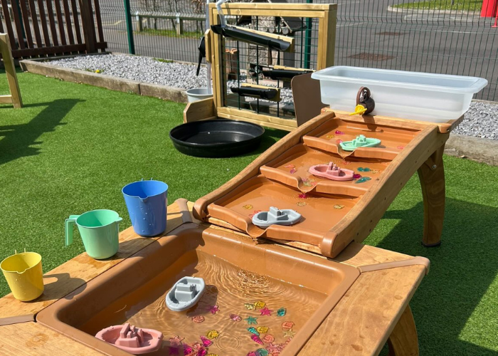 Outdoor water play set up by miss_e_early_years (Instagram)