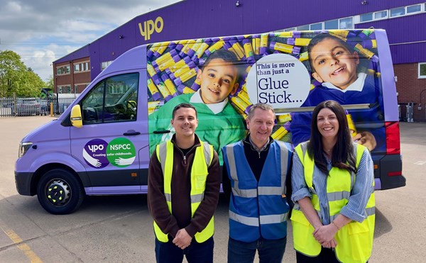 People in front of a van