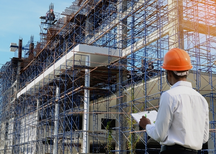 surveyor looking at scaffolding
