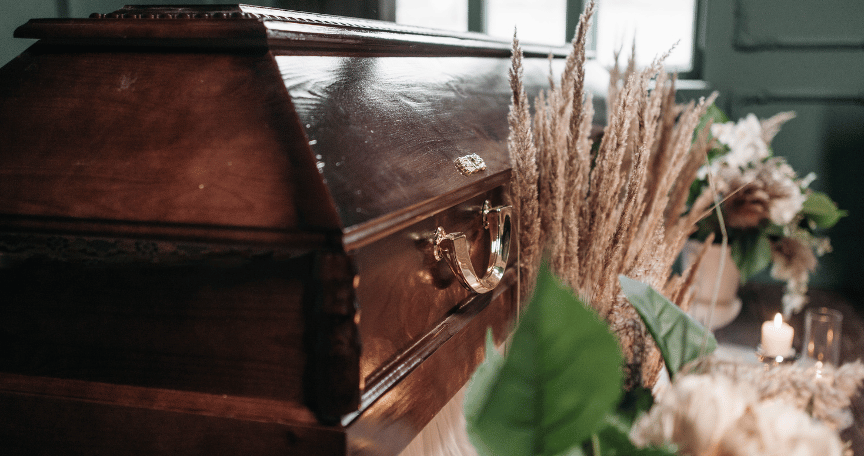 coffin and flowers