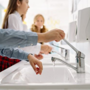Boy using tap