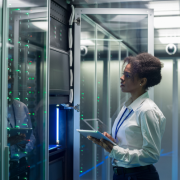 Female working on a tablet in a data centre 