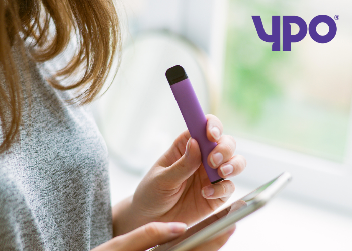 Woman holding a vape 