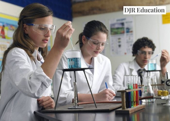secondary class experimenting during science lesson