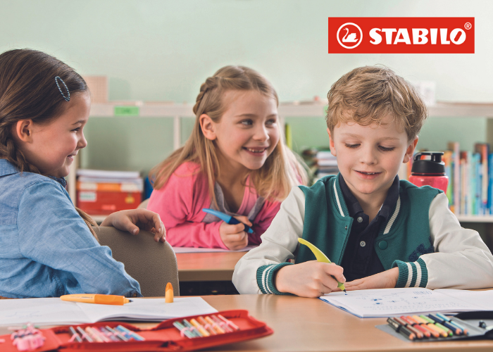 children writing in the classroom