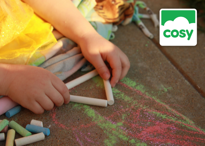 Child making shape outdoors