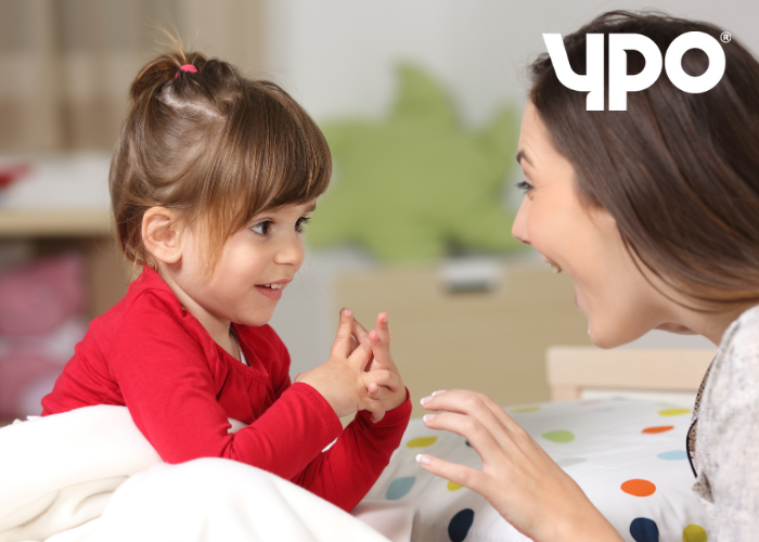 Young girl talking to an adult woman
