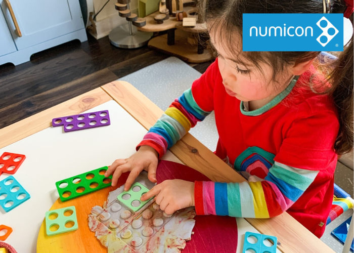 Girl using numicon