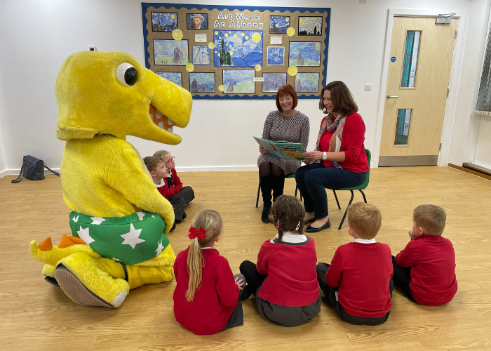 Children being read the NSPCC Pantosaurus book