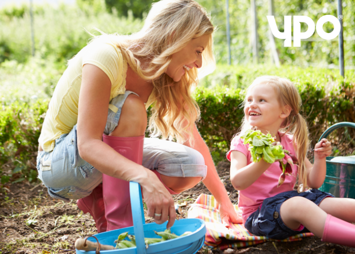 Woman and girl gardening