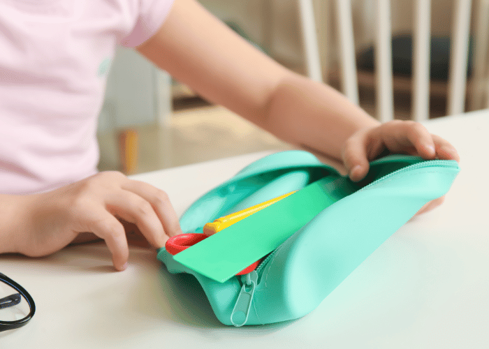 Child opening pencil case