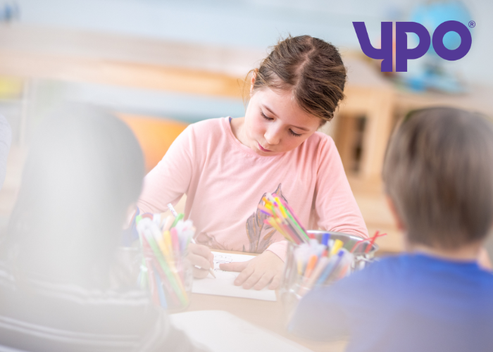 girl drawing in a classroom