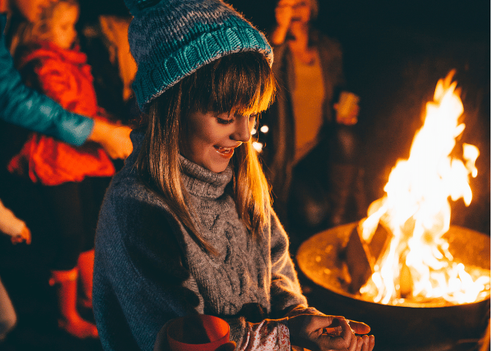 Young girl at bonfire