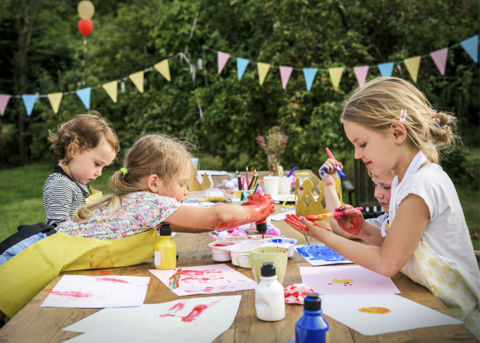 Children making crafts outside