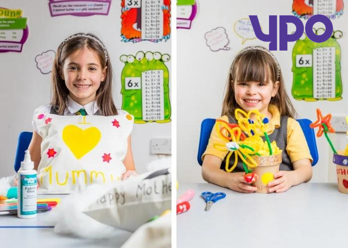 Children holding mother's day crafts