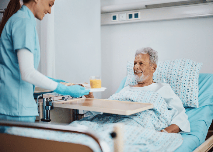 Man being served food in hospital