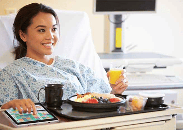 Hospital patient with food tray