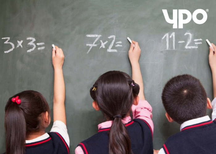 Children drawing on a chalkboard