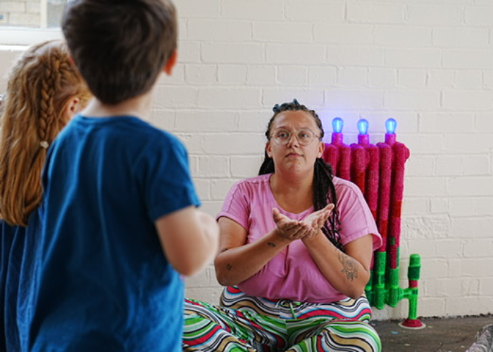 woman storytelling to children