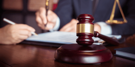 Legal office with a gavel at the forefront of the image