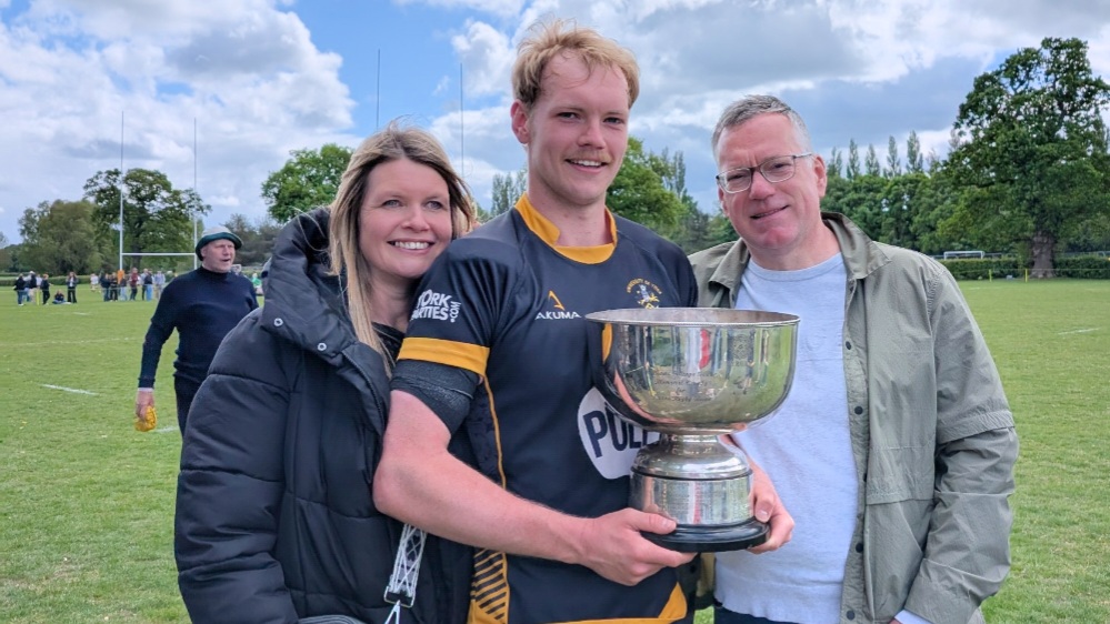 Jayden at the York v Lancaster University rugby match with dad Adrian and mum Charlotte