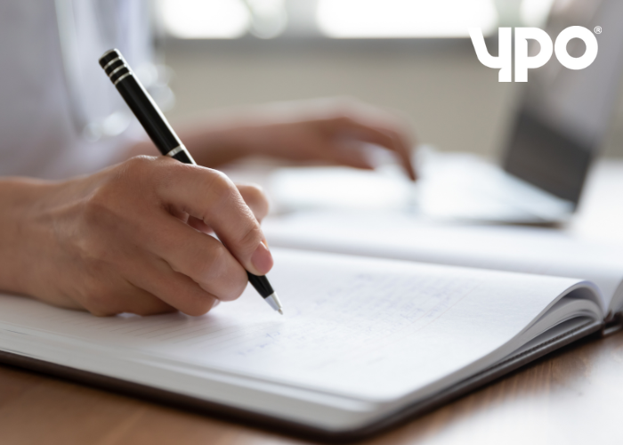 Writing in notebook