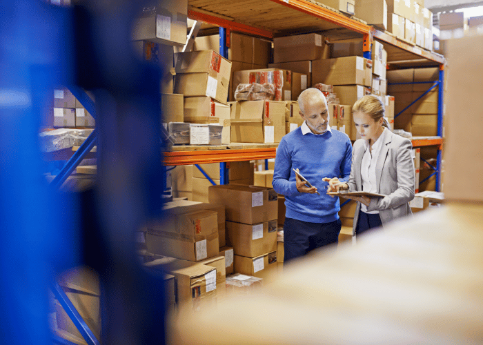 Man and woman working in warehouse